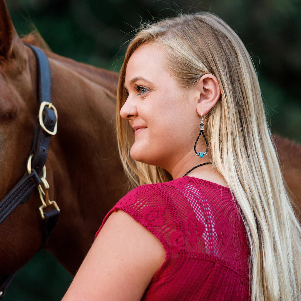 blonde woman wearing the maille turquoise horse hair earrings